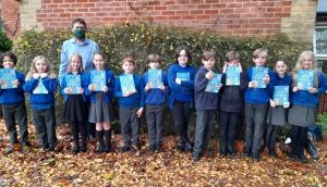 

Year 5 pupils at Palgrave Primary School being presented with their Dictionaries4life by Club President Elaine Bootman and Rotarian Linda Hewlett-Parker . 
